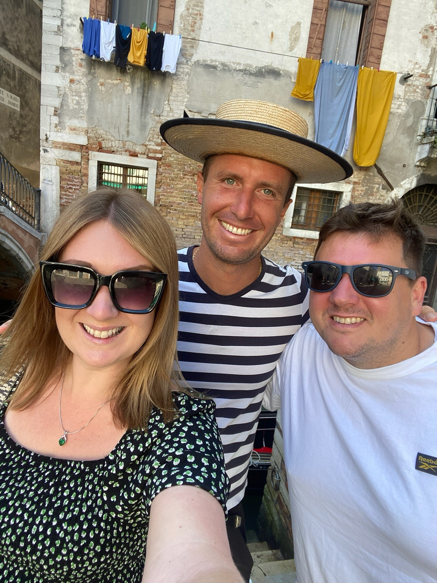 Man and women with a gondola man in Venice